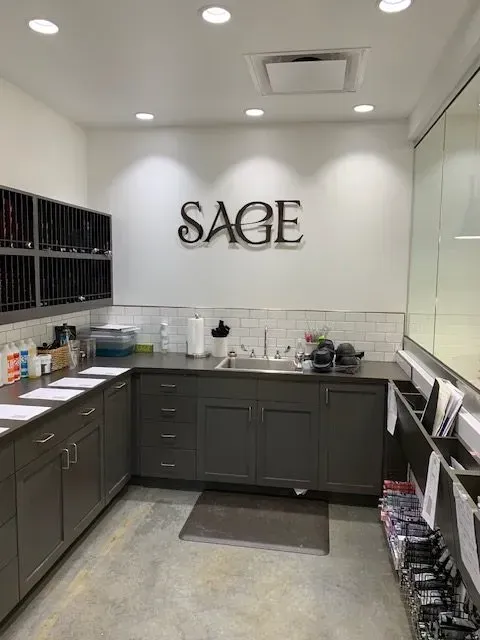 A studio with cabinets, sink, and the word